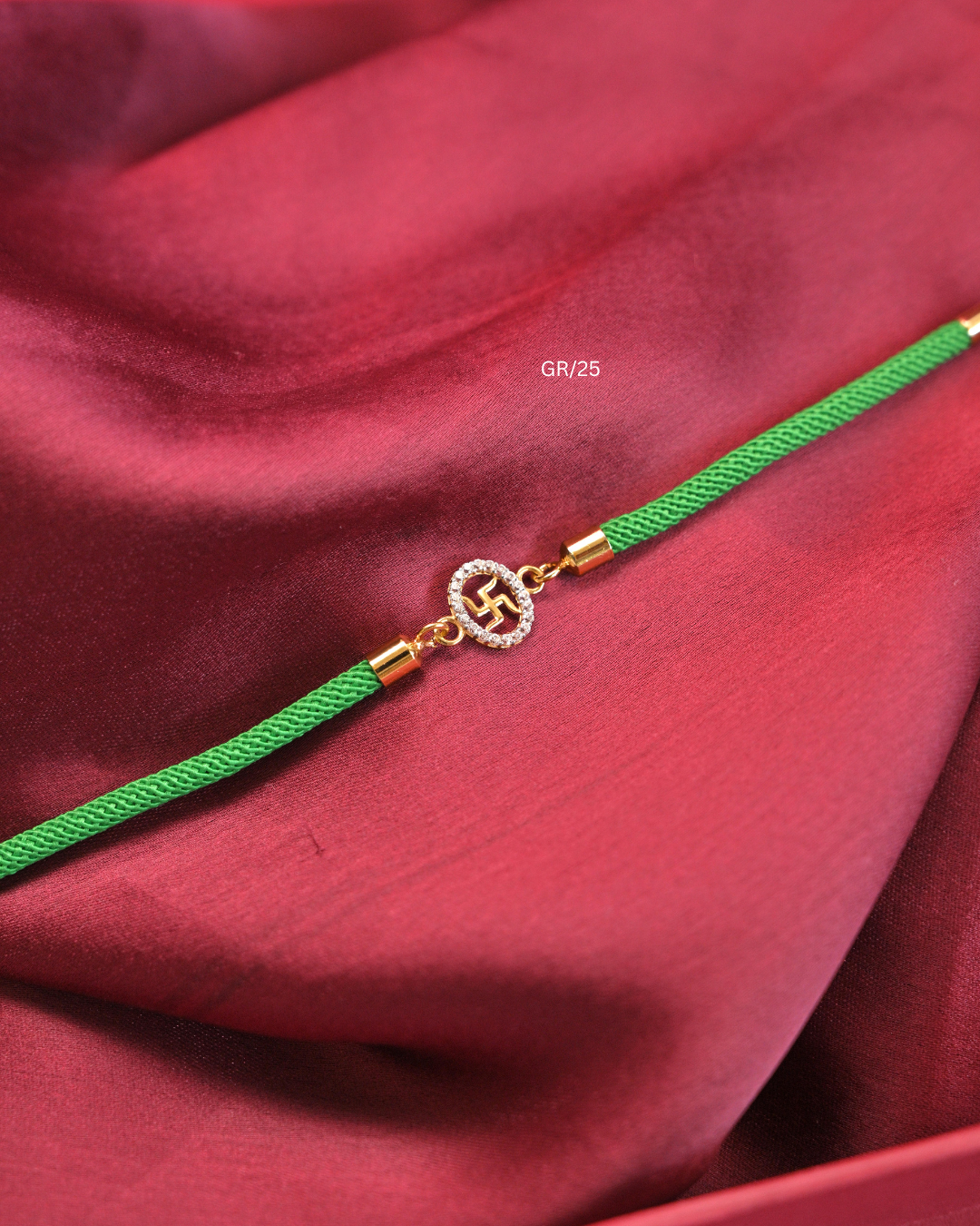 Sacred Swastik & CZ Halo Rakhi with Green Thread | SKU: GR/25