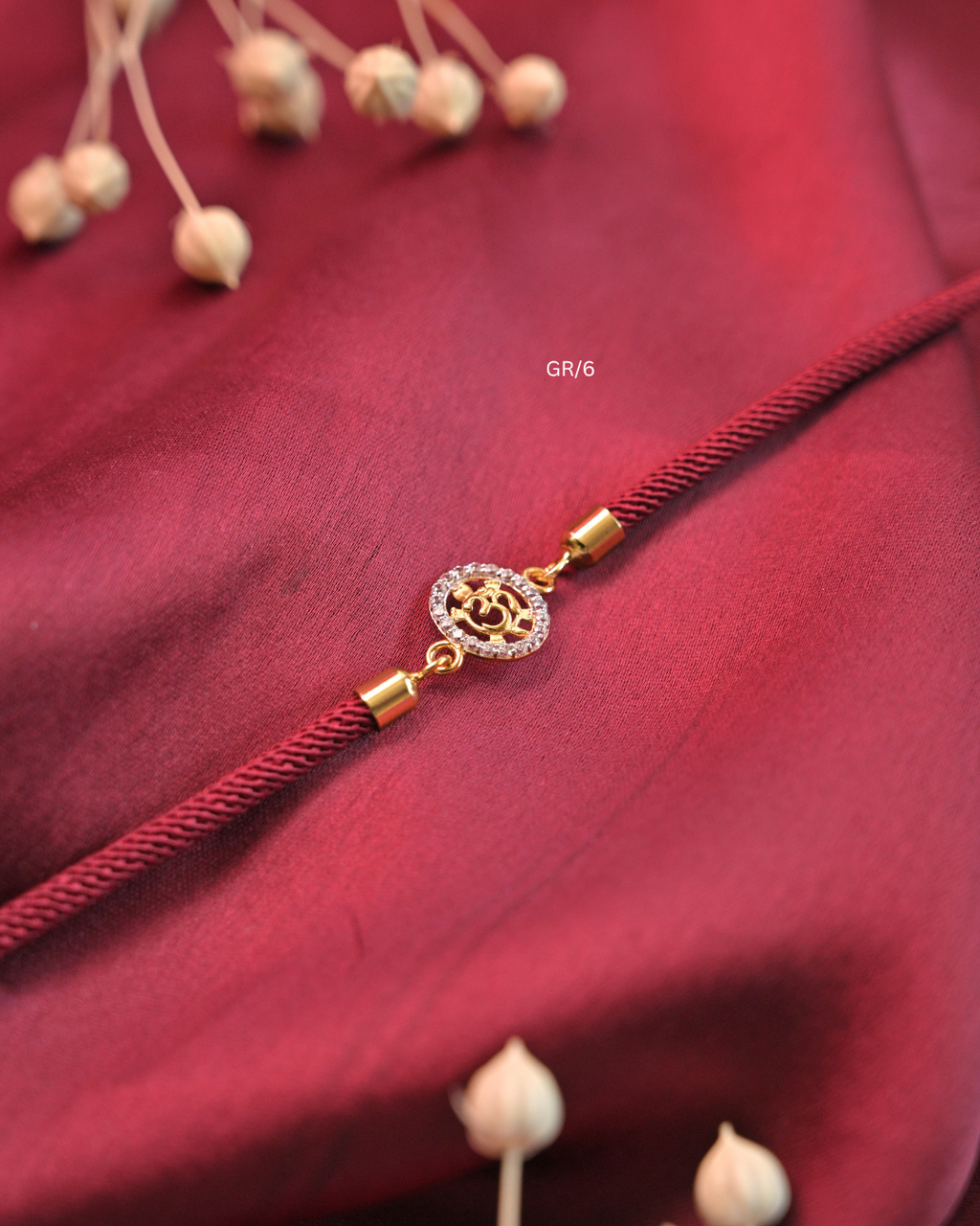 Sacred Om & CZ Halo Rakhi with Maroon Thread | SKU: GR/6