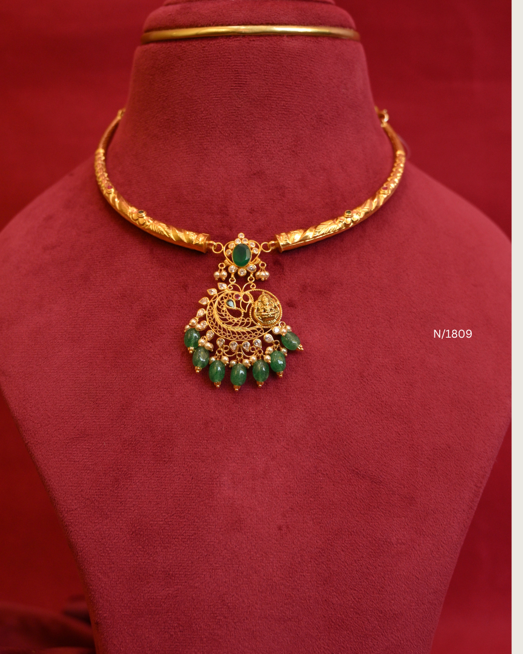 Goddess Lakshmi & Peacock Nakshi Pendant Tubular Hasli Necklace with Oval Emerald, CZ & Emerald Bead Drops | SKU: N/1809