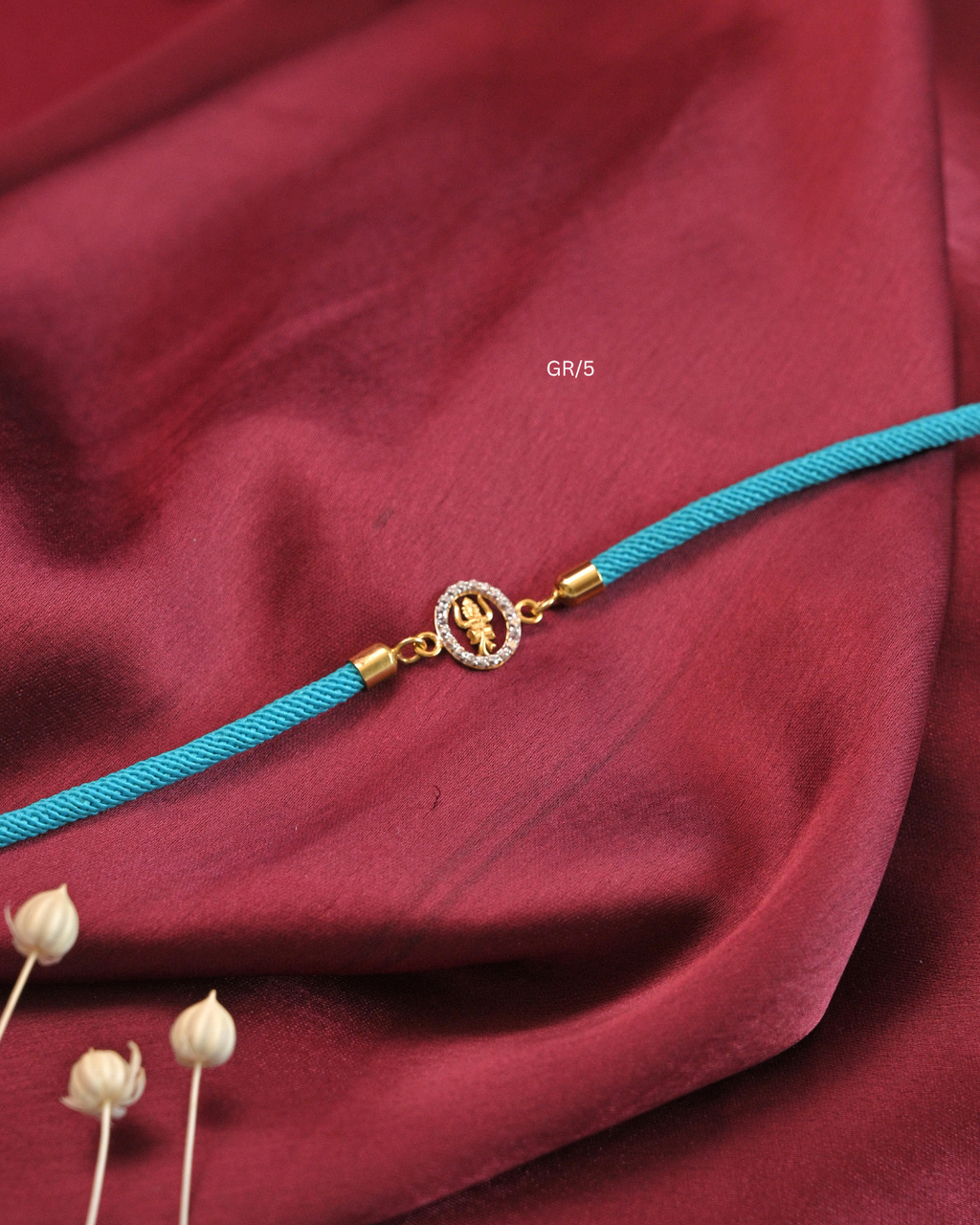 Sacred Trishul Damru & CZ Halo Rakhi with Cyan Thread |SKU: GR/5