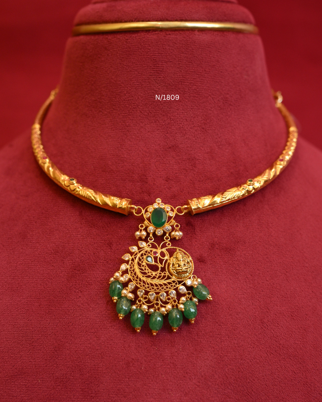 Goddess Lakshmi & Peacock Nakshi Pendant Tubular Hasli Necklace with Oval Emerald, CZ & Emerald Bead Drops | SKU: N/1809