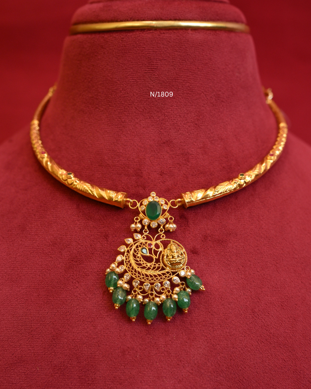 Goddess Lakshmi & Peacock Nakshi Pendant Tubular Hasli Necklace with Oval Emerald, CZ & Emerald Bead Drops | SKU: N/1809