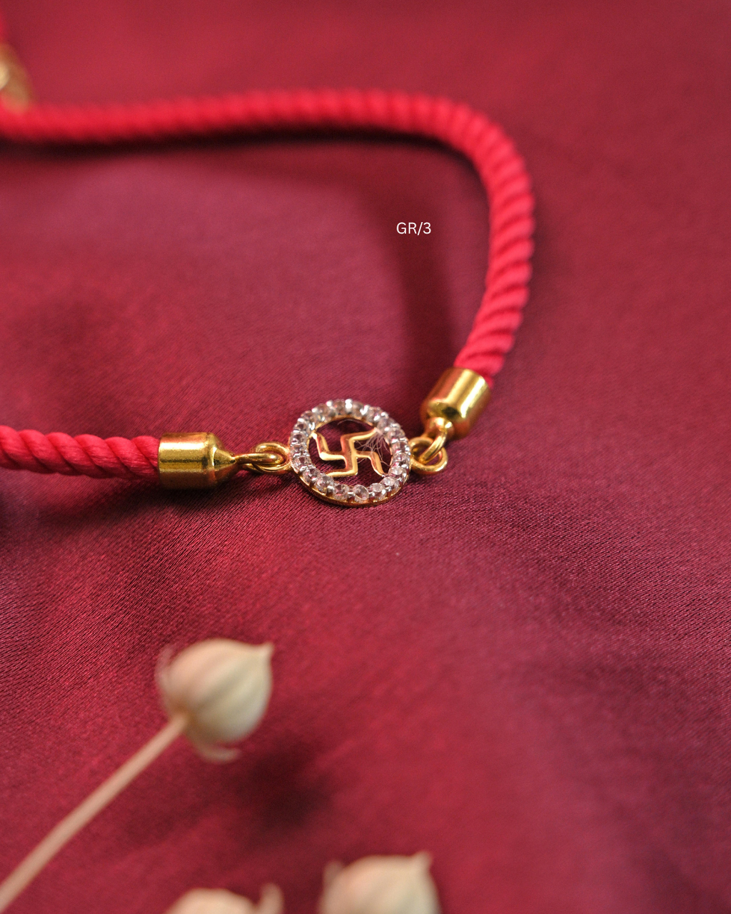 Sacred Swastik & CZ Circular Halo Rakhi with Red Thread | SKU: GR/3