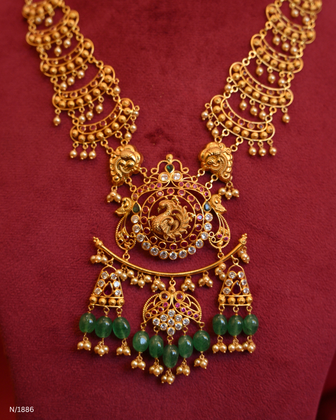 Grand Peacock Nakshi Temple Haram with Multi-Strand Pearls & Emerald Tassels | SKU: N/1886