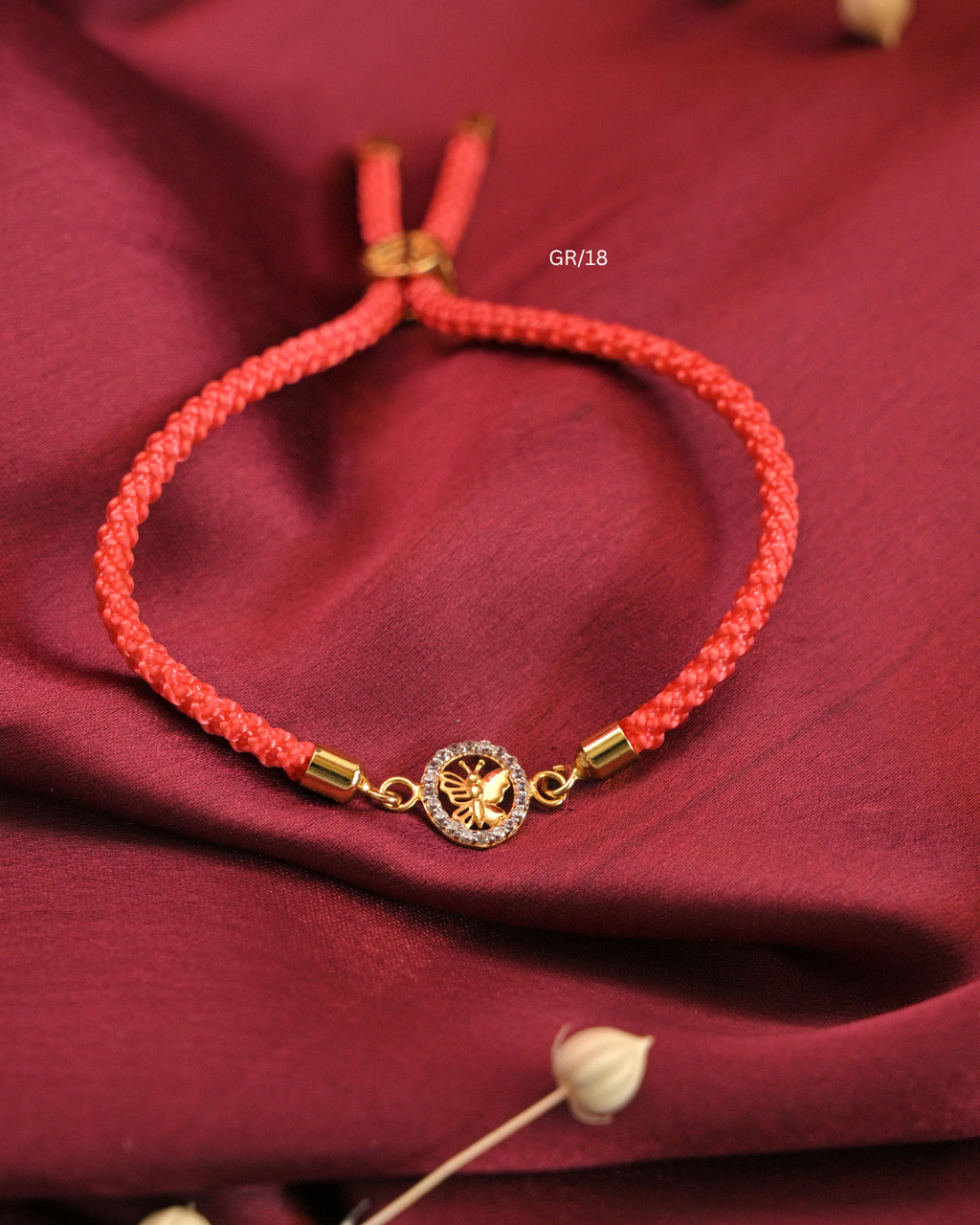 Sculpted Butterfly & CZ Circular Halo Rakhi with Coral Pink Thread |SKU: GR/18