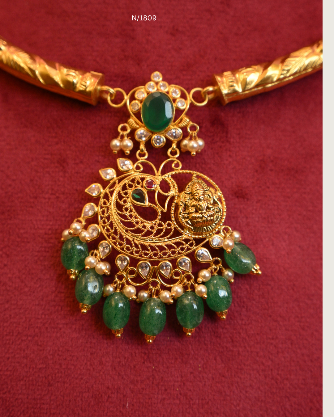 Goddess Lakshmi & Peacock Nakshi Pendant Tubular Hasli Necklace with Oval Emerald, CZ & Emerald Bead Drops | SKU: N/1809