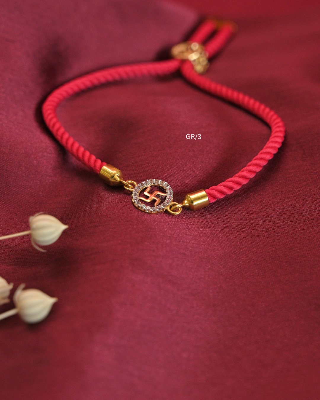 Sacred Swastik & CZ Circular Halo Rakhi with Red Thread | SKU: GR/3