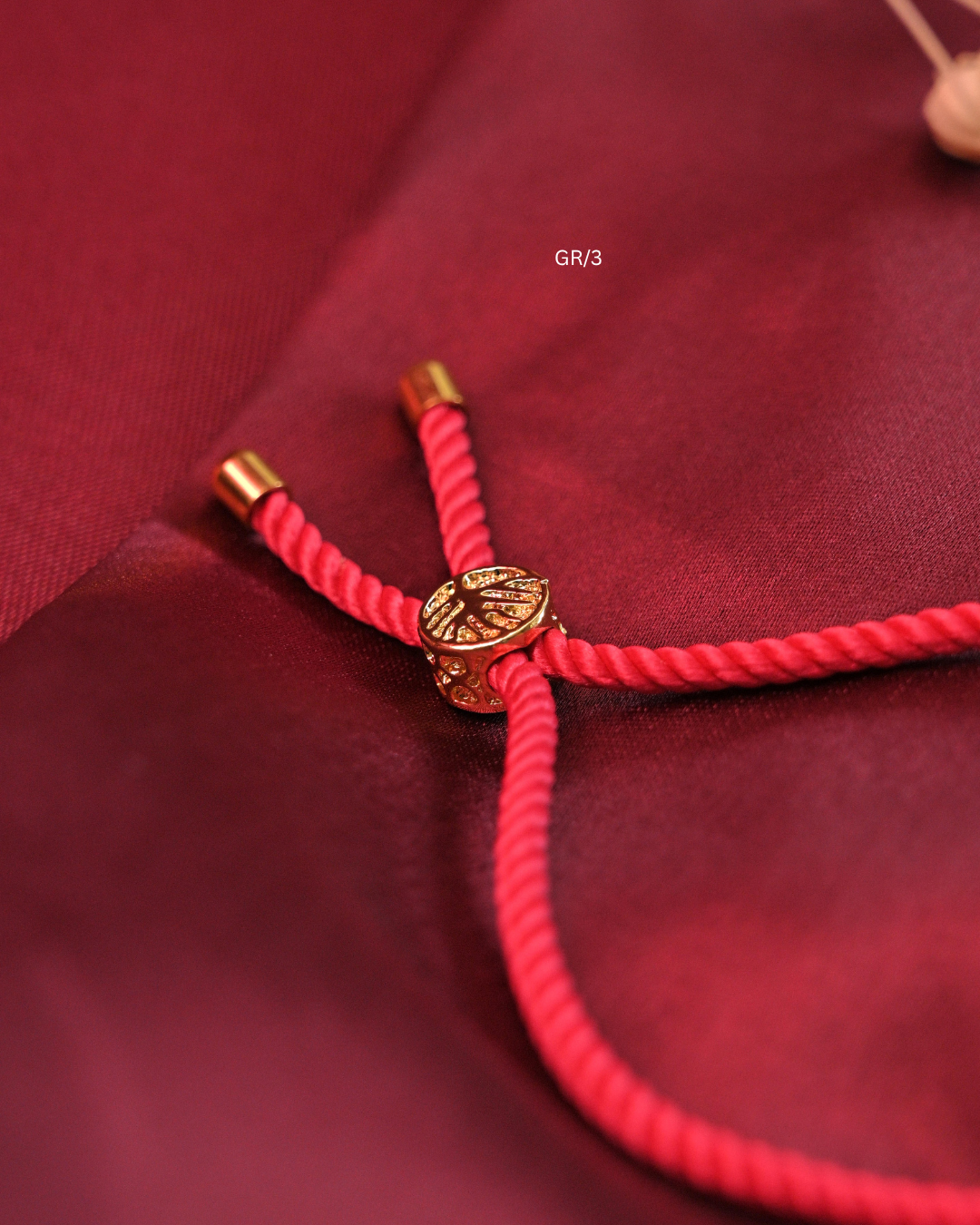 Sacred Swastik & CZ Circular Halo Rakhi with Red Thread | SKU: GR/3