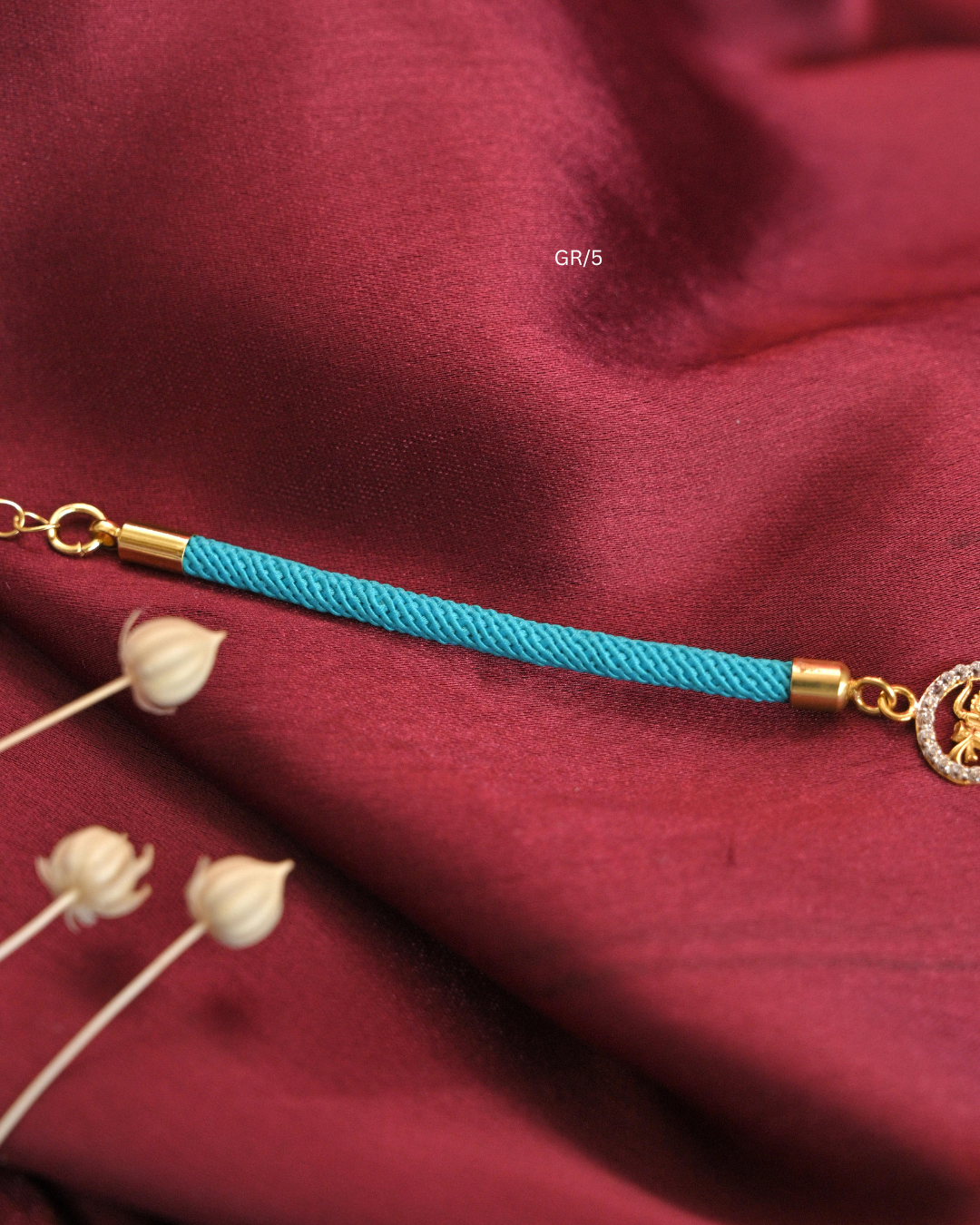 Sacred Trishul Damru & CZ Halo Rakhi with Cyan Thread |SKU: GR/5