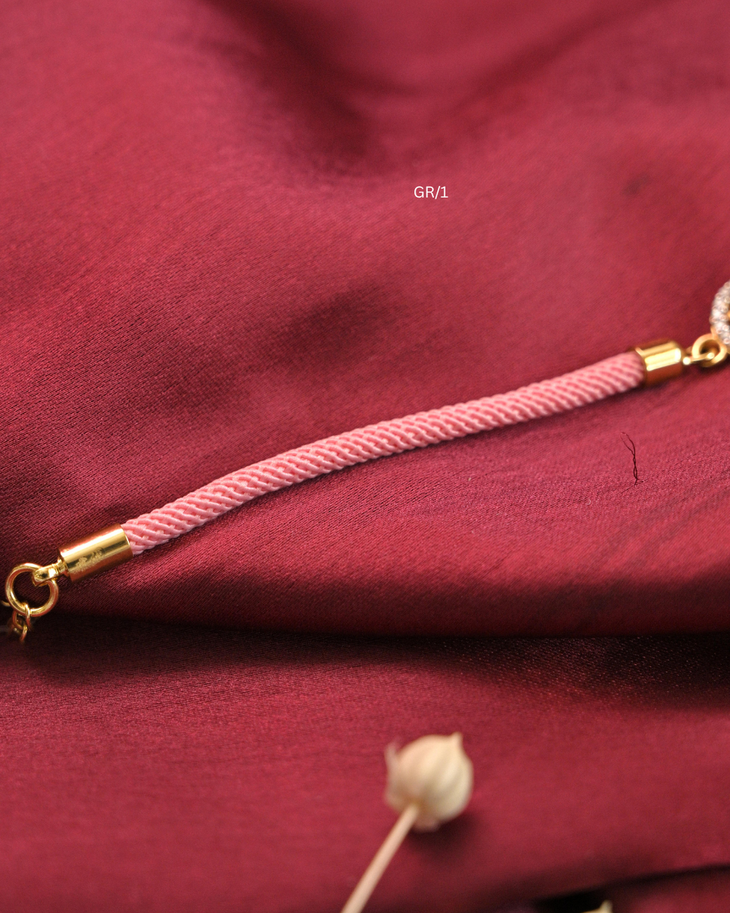 Sacred Swastik & CZ Circular Halo Rakhi with Blush Pink Thread |SKU: GR/1