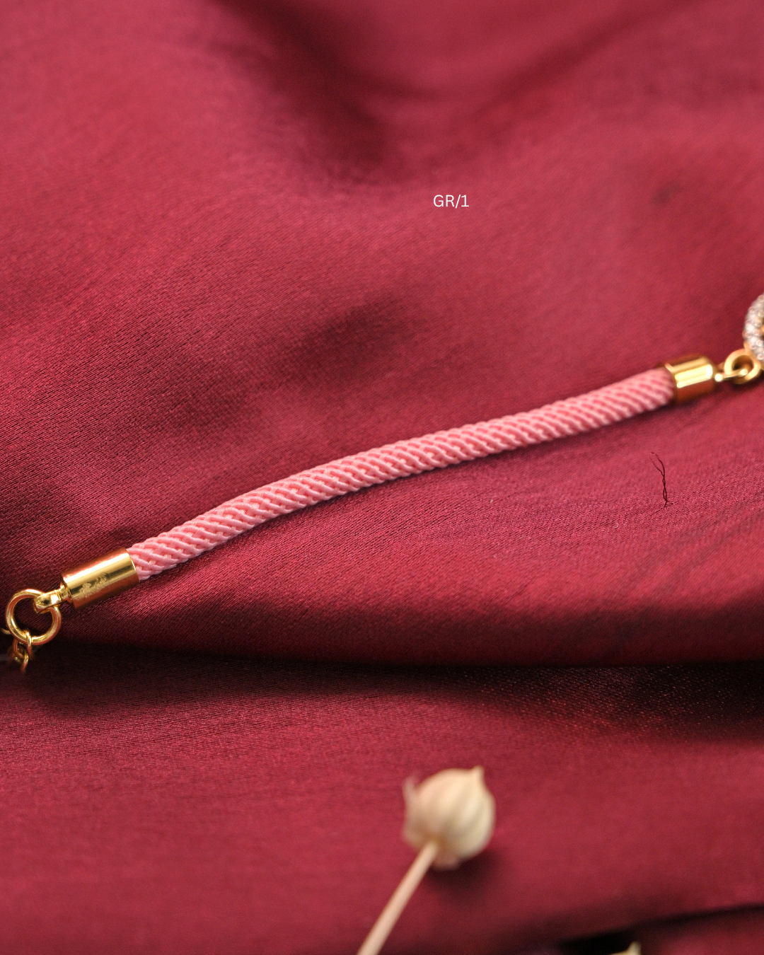 Sacred Swastik & CZ Circular Halo Rakhi with Blush Pink Thread |SKU: GR/1